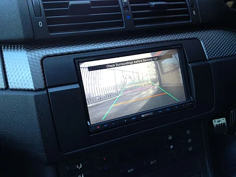 BMW 3 Series (E46) with double din modification and reverse camera installed.